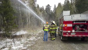 Picture of Mosca-Hooper VFD extinguishing a weather-related fire caused by a downed power line.